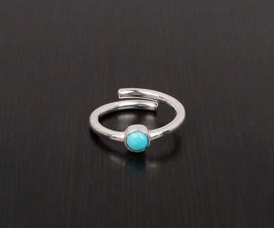 Artisan turquoise gemstone ring with radiant silver setting and bold, bohemian charm