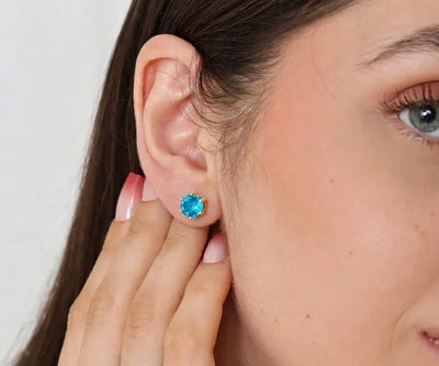 Aquamarine stud earrings featuring sparkling light blue gemstones set in elegant minimalist design, perfect for March birthstone jewelry and everyday wear