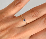 Elegant sterling silver ring featuring a deep blue lab-created sapphire for everyday fine jewelry style