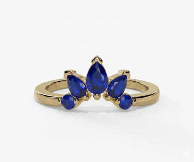 Blue sapphire engagement ring featuring a teardrop pear cut stone with timeless brilliance