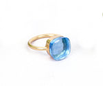 Elegant sterling silver ring featuring a large lab-created blue topaz for everyday or evening wear