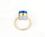 Contemporary blue topaz ring with radiant color and classic silver craftsmanship