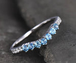 Delicate blue topaz wedding ring in sterling silver, blending clean design with soft, romantic sparkle