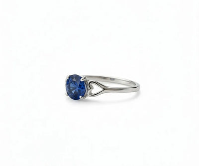 Sapphire and white diamond ring that combines classic elegance with a touch of vibrant blue brilliance