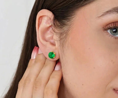 Emerald stud earrings in gold setting featuring vibrant green gemstone, elegant minimalist jewelry for everyday wear and special occasions