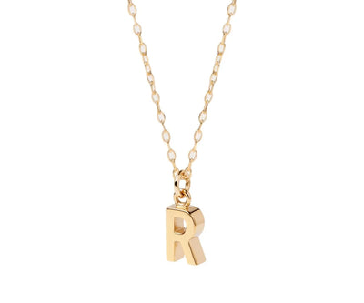 Dainty initial necklace with letter R pendant in gold on a delicate chain for everyday wear