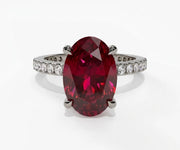 Vintage inspired oval ruby ring with deep crimson gemstone and refined delicate setting