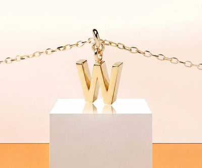 Elegant W initial necklace with a fine gold chain perfect for everyday wear