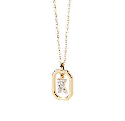 A letter K necklace gold featuring a polished “K” pendant on a delicate gold chain, offering a personalized and elegant jewelry piece.