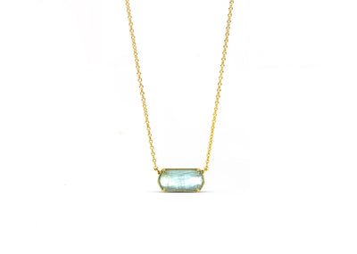 Custom-cut blue topaz pendant reflecting tranquil tones