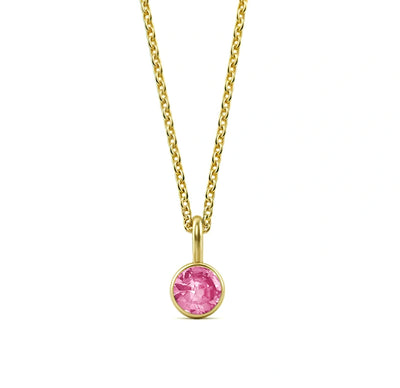 This pink tourmaline birthstone necklace features a soft blush gemstone set in a dainty pendant necklace for women.