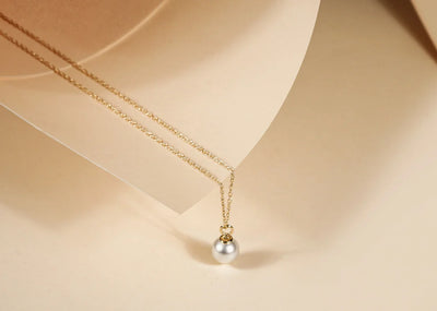 A tiny pearl necklace featuring a delicate chain with a small, lustrous pearl pendant, Dainty freshwater pearl pendant necklace on gold chain – women's minimalist pearl jewelry by Rarete Jewelry