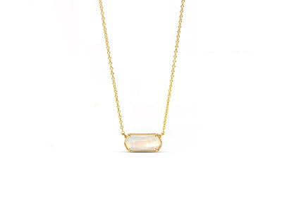 Close-up of Aurora Opal gemstone with gold setting birthstone opal necklace