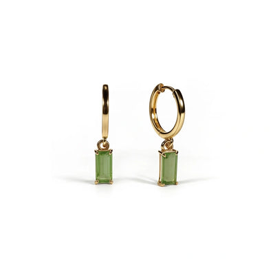 Gold hoop earrings with dangling baguette-cut peridot gemstone, finished in yellow gold plating over brass.
large hoop earrings
thick hoop earrings
rose gold hoop earrings
chunky gold earrings
chunky gold earrings
chunky gold hoops
thick gold hoops
charm hoop earrings
diamond hoop earrings
diamond hoops
gold diamond hoop earrings
diamond hoop earrings for women