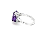 Amethyst center stone ring with sparkling white zircon accents set in elegant sterling silver
