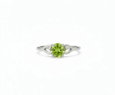 Peridot ring featuring a vibrant green gemstone set in a delicate band, blending fresh elegance with everyday sophistication