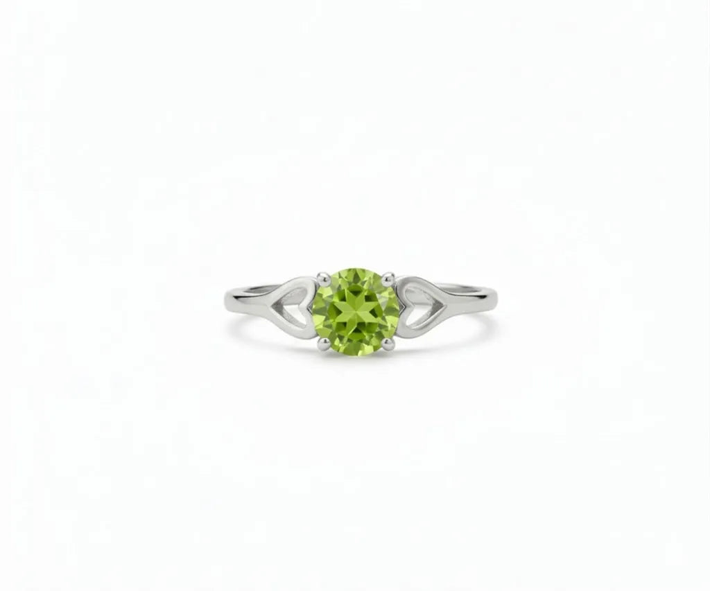 Peridot ring featuring a vibrant green gemstone set in a delicate band, blending fresh elegance with everyday sophistication