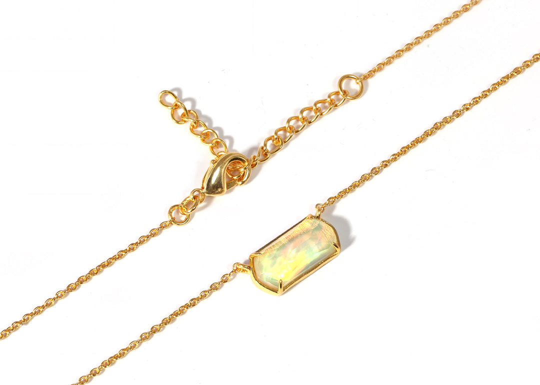 Custom-cut opal pendant on a delicate gold chain