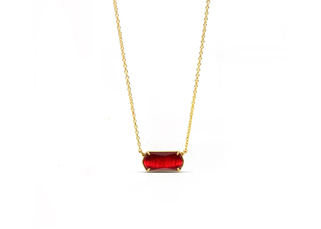 Model wearing ruby necklace for a bold look