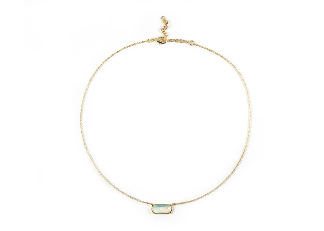 Model wearing Aurora Opal necklace with a soft glow