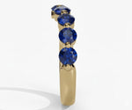 Classic blue sapphire engagement ring featuring round cut lab-created sapphire with timeless sparkle
