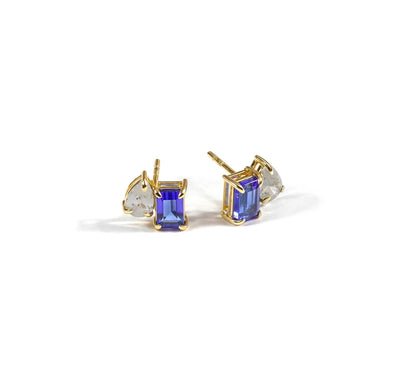 Blue diamond stud earrings featuring sparkling blue diamonds set in a classic, elegant stud design for a luxurious look.