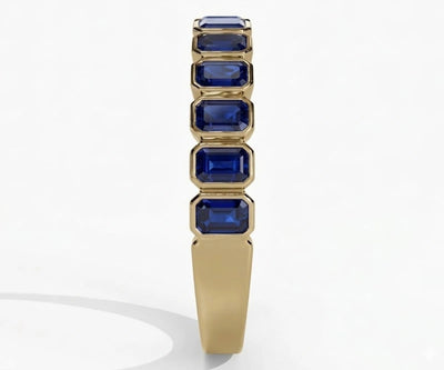 Elegant blue sapphire ring featuring emerald cut stone set in polished sterling silver for timeless sophistication