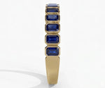Elegant blue sapphire ring featuring emerald cut stone set in polished sterling silver for timeless sophistication
