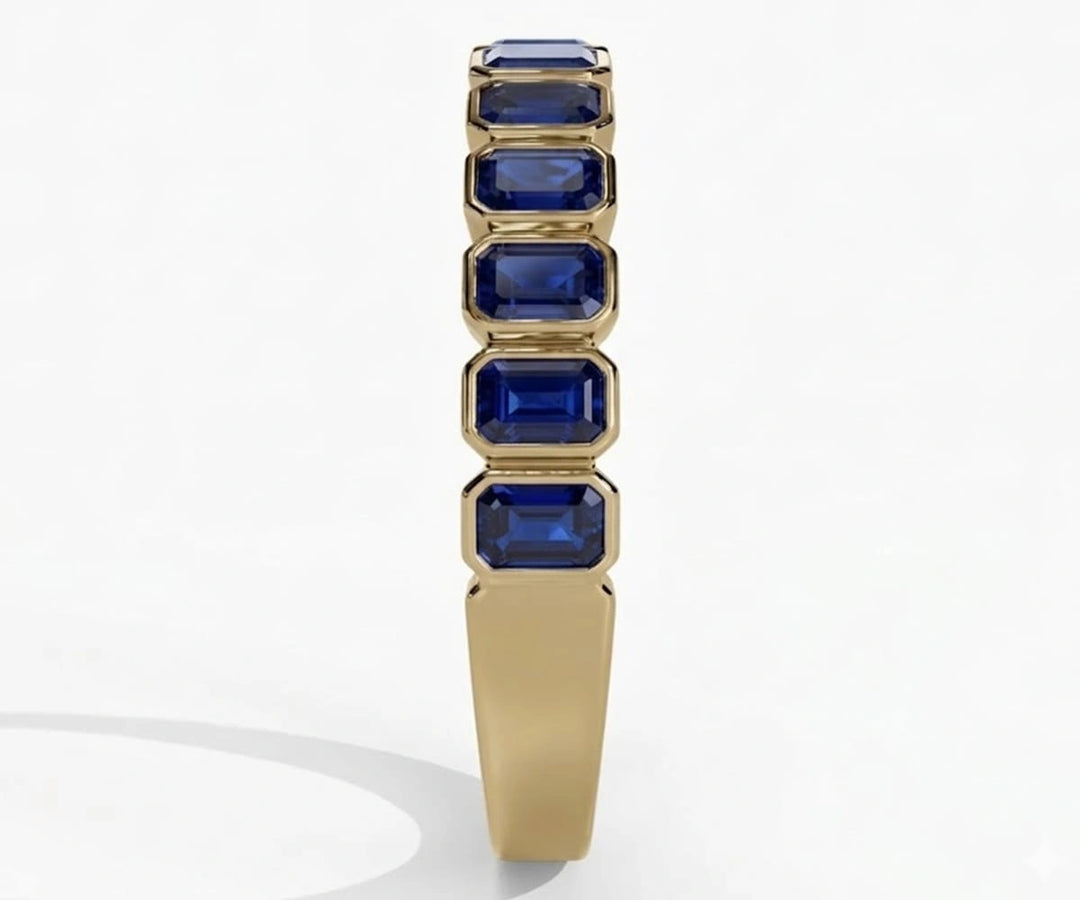 Elegant blue sapphire ring featuring emerald cut stone set in polished sterling silver for timeless sophistication