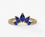 Blue sapphire engagement ring featuring a teardrop pear cut stone with timeless brilliance
