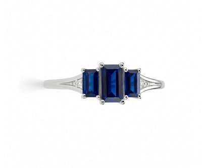 Oval sapphire ring with white zircon halo set in sterling silver offering brilliant sparkle and classic gemstone style