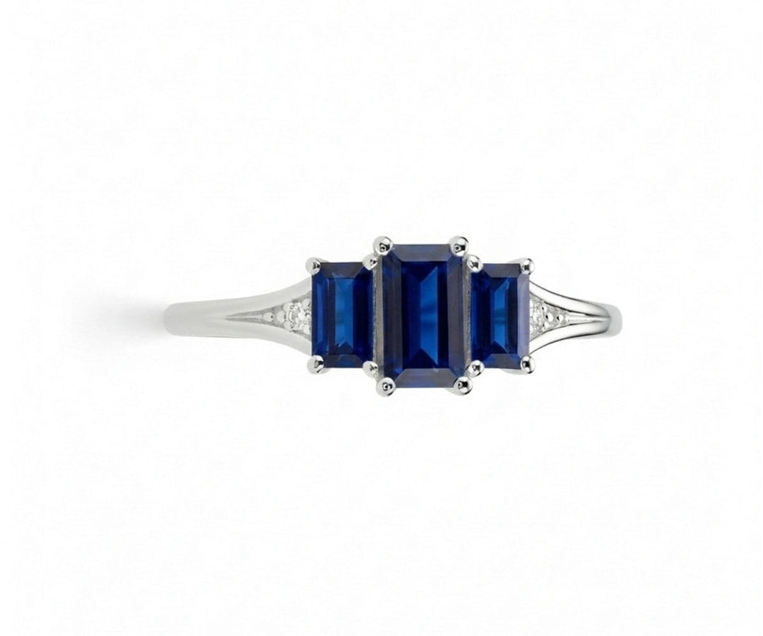 Oval sapphire ring with white zircon halo set in sterling silver offering brilliant sparkle and classic gemstone style