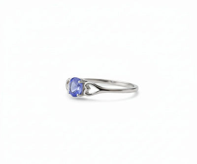 Tanzanite and sterling silver ring that exudes elegant sophistication with a vibrant blue-violet gemstone centerpiece.
