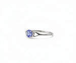 Tanzanite and sterling silver ring that exudes elegant sophistication with a vibrant blue-violet gemstone centerpiece.

