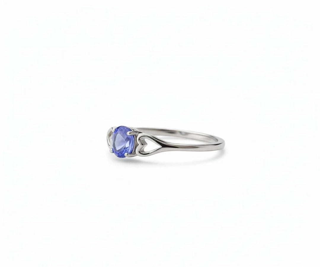 Tanzanite and sterling silver ring that exudes elegant sophistication with a vibrant blue-violet gemstone centerpiece.