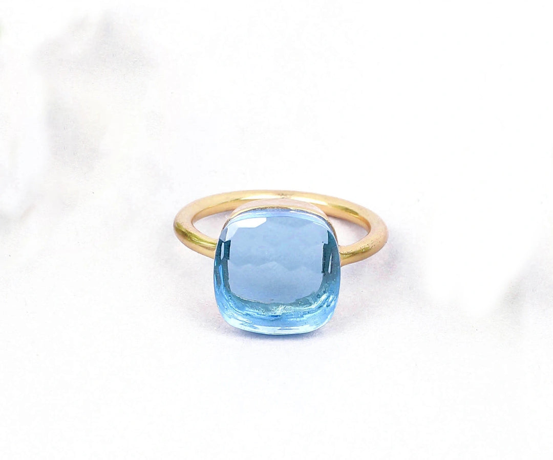 Statement silver ring with a vibrant blue topaz hydro gemstone, perfect for confident, elegant style


