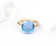 Statement silver ring with a vibrant blue topaz hydro gemstone, perfect for confident, elegant style


