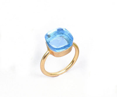 Bold and beautiful 925 silver ring showcasing a vivid 12x12 mm blue topaz hydro centerpiece
