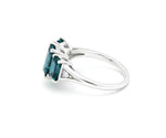 Elegant indigolite with white zircon ring featuring a rich blue-green center stone and brilliant zircon sparkle in sterling silver
