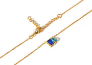 Emerald-cut sapphire and pear-cut topaz pendant necklace