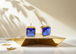 Load image into Gallery viewer, 18K yellow gold-plated studs with 10mm Asscher cut Blue Sapphire.
