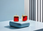 Load image into Gallery viewer, Modern square design studs with 10mm Fiery Garnet and secure push-back closure.
