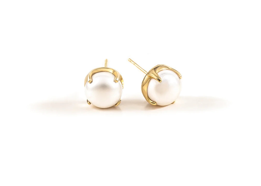 Oversized 10mm freshwater pearl studs on display
