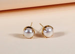 Load image into Gallery viewer, Bold pearl stud earrings with yellow gold plating
