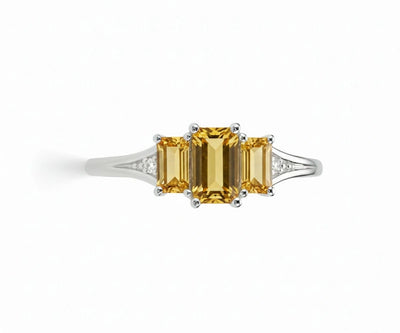 Elegant citrine and white zircon ring set in sterling silver with a warm golden center stone and brilliant zircon sparkle
