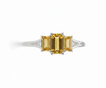 Elegant citrine and white zircon ring set in sterling silver with a warm golden center stone and brilliant zircon sparkle
