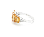 Golden citrine gemstone ring with shimmering white zircon accents in a sleek sterling silver setting for timeless elegance
