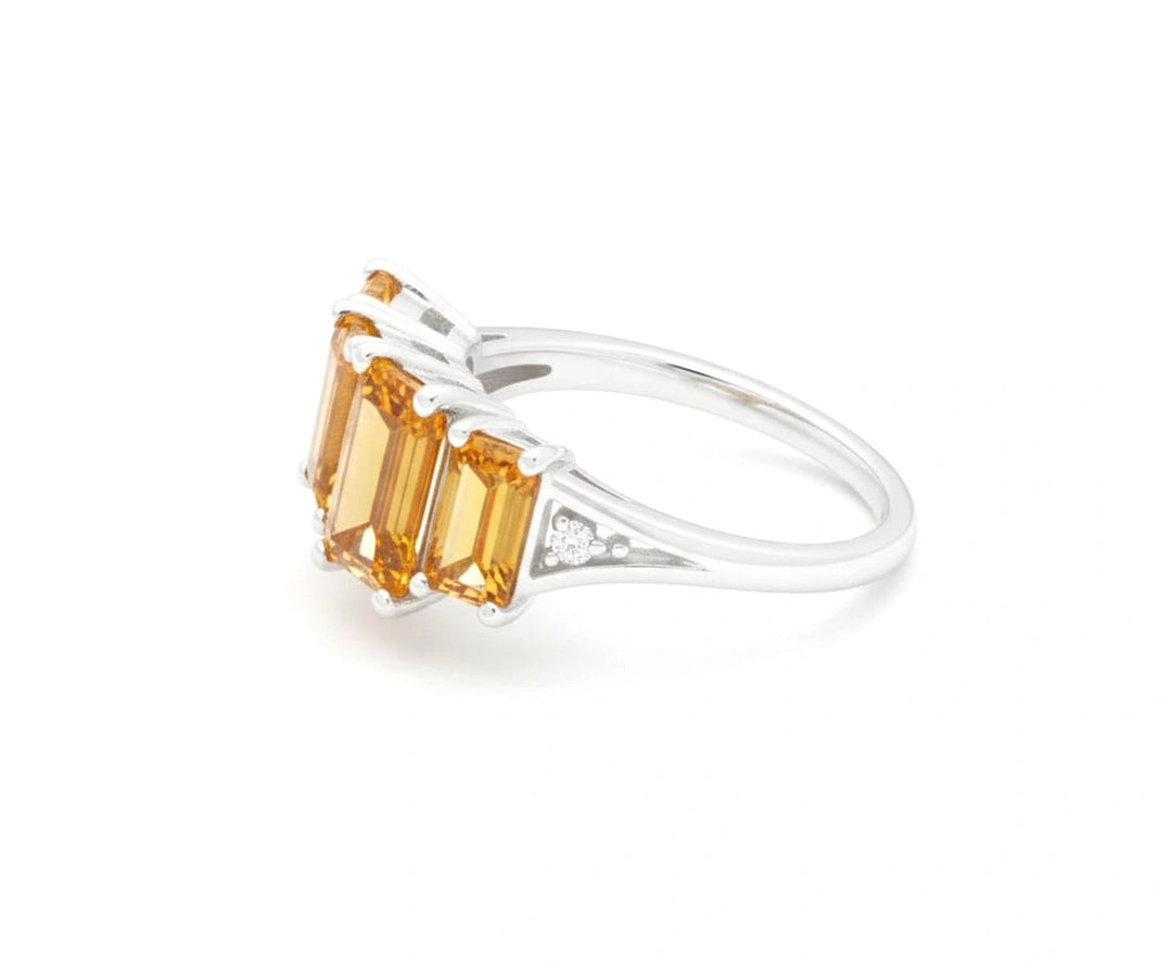 Golden citrine gemstone ring with shimmering white zircon accents in a sleek sterling silver setting for timeless elegance