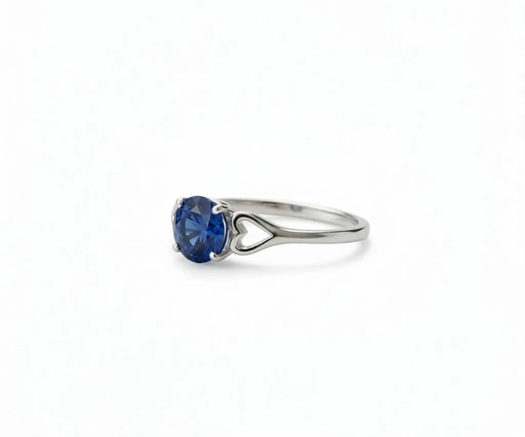 Sapphire and white diamond ring that combines classic elegance with a touch of vibrant blue brilliance