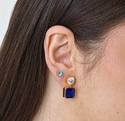 September birthstone-inspired dangle earrings featuring rich sapphire hues and luxurious 18K yellow gold plating